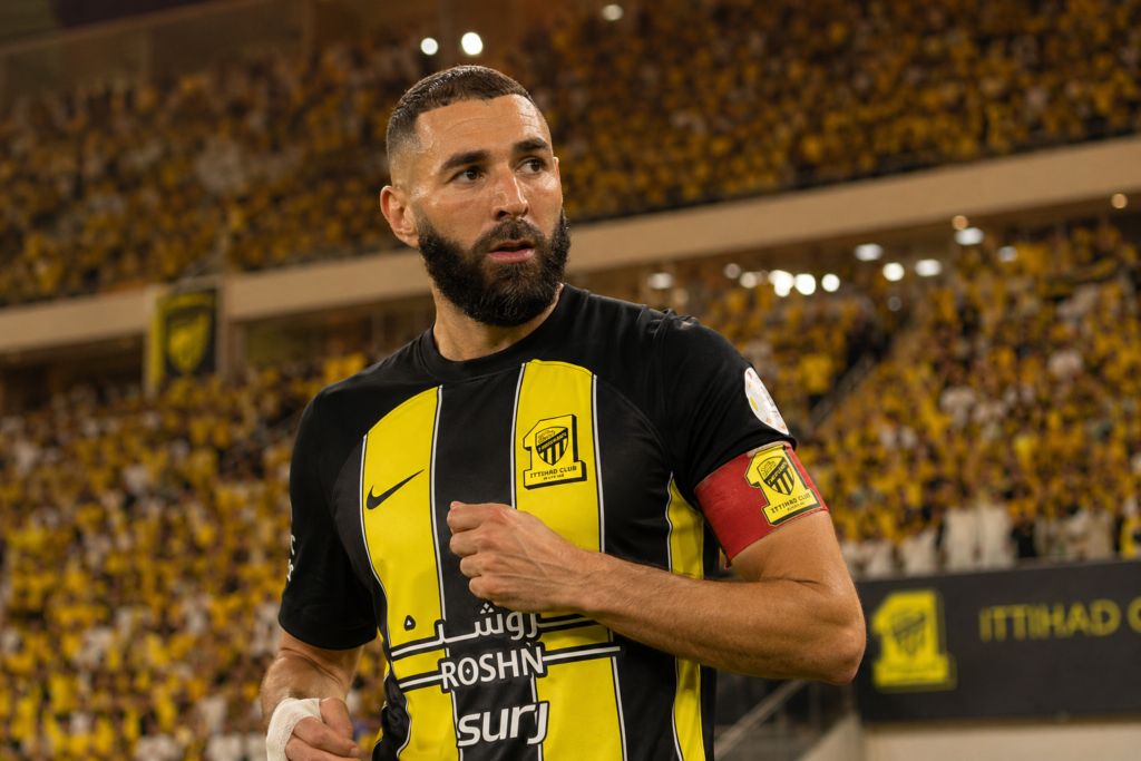 Karim Benzema playing for Al-Ittihad in a Saudi Pro League stadium