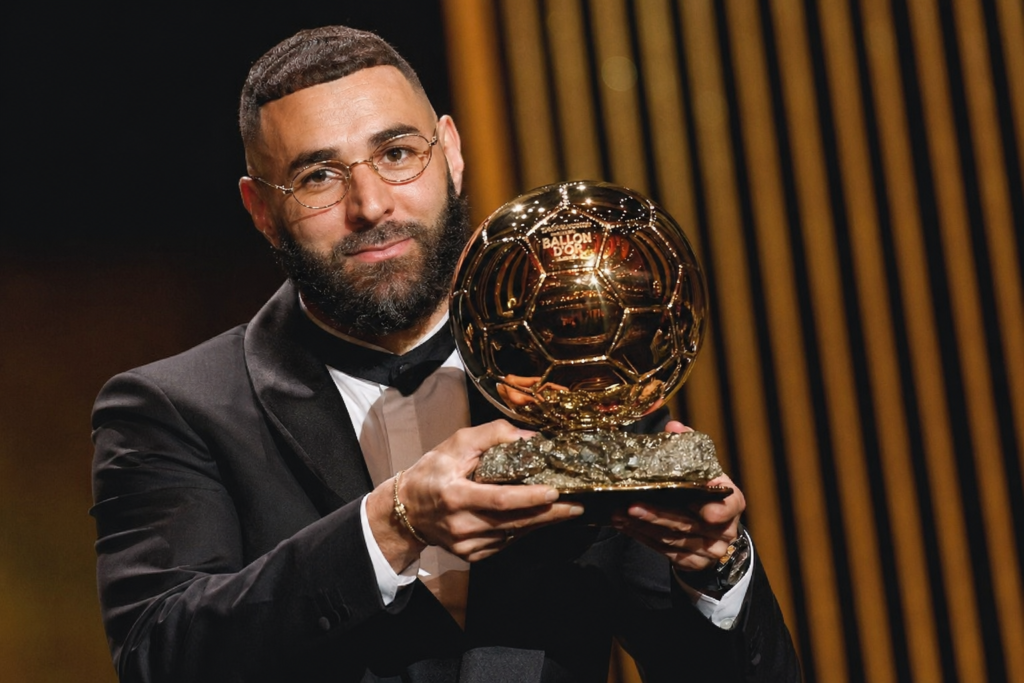 Karim Benzema holding the Ballon d'Or trophy during the 2022 award ceremony