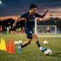Football player controlling the ball with precision during training with dynamic motion effects
