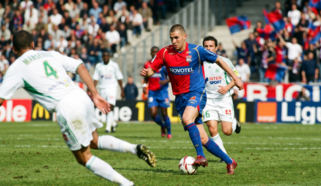 Karim Benzema celebrating a goal for Olympique Lyonnais in a Ligue 1 match