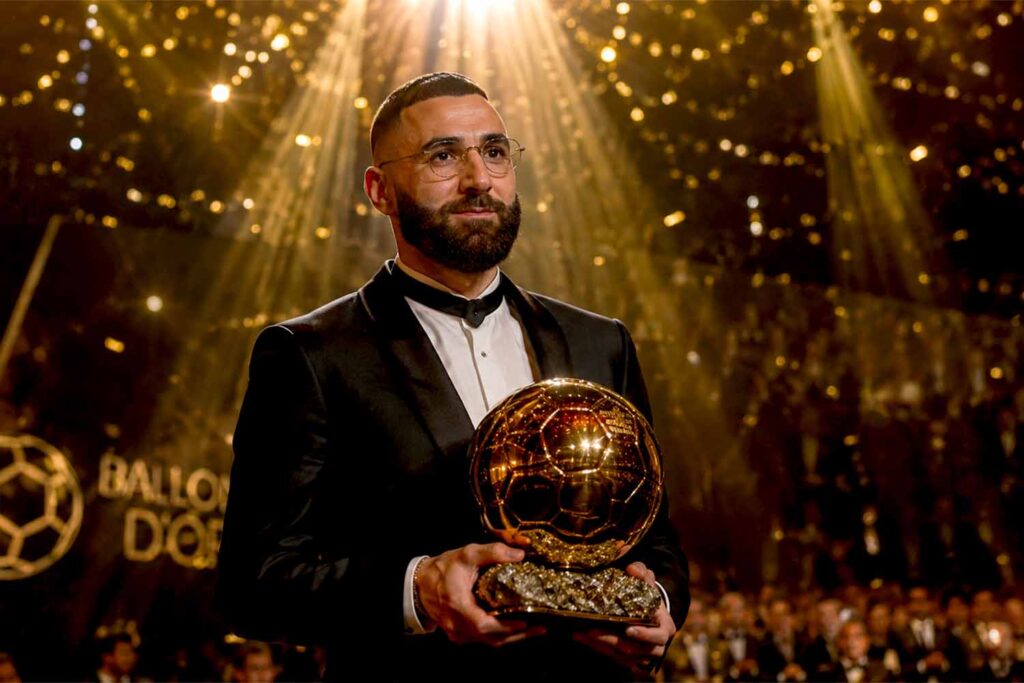 Karim Benzema holding the Ballon d'Or trophy during the prestigious award ceremony