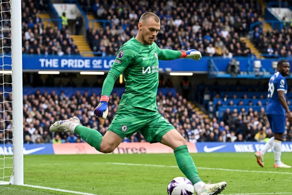 Filip Jörgensen distributing the ball from the back during a football match for Brighton.