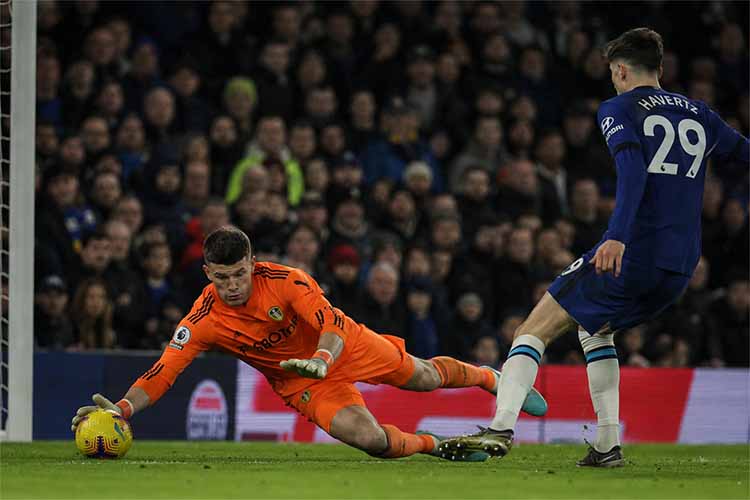 Illan Meslier making a save during his Leeds United career, young football goalkeeper in action