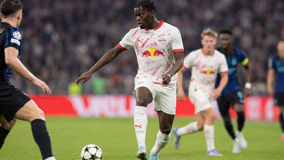 Castello Lukeba stepping forward to intercept an attacking pass for RB Leipzig