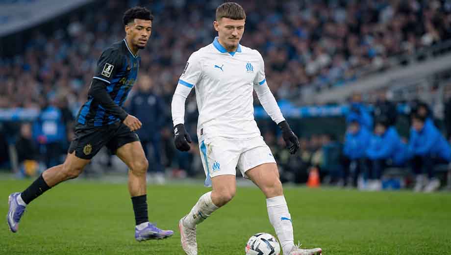Quentin Merlin controlling the ball for Marseille during a Ligue 1 match, one of the upcoming-defender-2026 talents to watch.